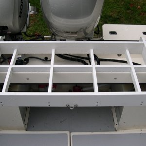 Installed rack.  Outside dimensions are 17.5" by 37".  Constructed with 1x4 and 1x2 plastic lumber (outdoor molding) found at Home Depot thanks to Tyboo.  Note cross pieces installed to reduce water entering cockpit from the motor well when cooler is in place.