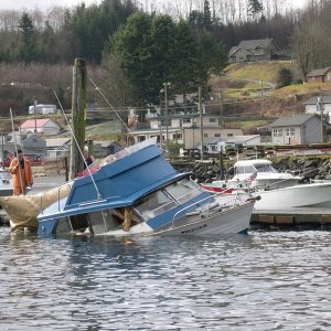 Moral of the Story:  Tie up to the dock or something that floats instead of the piling.  Second time I've witnessed this at Sekiu in the last year.
