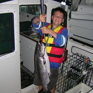 July 18th.  Mason is holding the fish that he netted but it fell through the net.  Turned out the metal ring at the bottom of the net had broken and many of the loops were off.