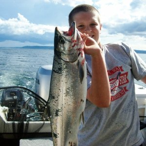Possession Coho.  Caught 55' down on chartruse hootchie.  Not a bad bonus on top of the kings. 7/16/2011
