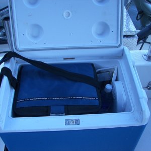 Media 'Cooler in Portable Fridge for one or two ppl. Only plug in when engine running or shore power, but extends ice life and easy to take ketchup, mayonnaise, cheese, milk back home in shoulder strap cooler.' in album 'Perko rod storage area'