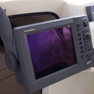 Multifunction Display 2...
I fabricated the custom bracket you see using a Dremel tool and the table mount bracket that came with the unit.  Metal paint primer matched the color of the Furuno unit perfectly.