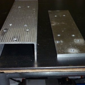 notice stock support 3/8 plate next to it. First bolted plate in place with 1/4 x 20 stainless bolts and lock nuts. Then used existing holes to drill the 3/8 holes for mounting to trailer's frame. Longer bolts were required 1 3/4 worked with nylon lock nuts