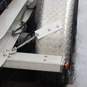 Used existing hole and bolt added the turnbuckle mounted wiith backing plate tightened up turnbuckle. Did stiffen up fenders added to front and back both sides