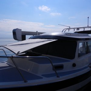 Here is the awning tied up at the top of the bow rail all the way around.