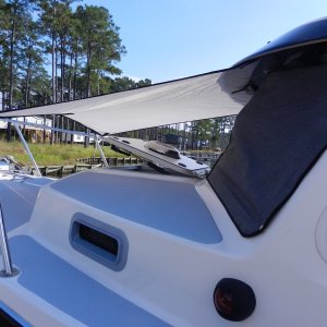 Media 'Here is the underneath.' in album 'Awning was a basic square (I'll update side dimensions when I get back down to the boat).  Sides were cut with a curve to stretch tight when corners were pulled.  We used some leftover "Oyster" Sunbrella fabric.'