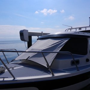 Media 'You can also put it all the way down low for really bad weather.' in album 'Awning was a basic square (I'll update side dimensions when I get back down to the boat).  Sides were cut with a curve to stretch tight when corners were pulled.  We used some leftover "Oyster" Sunbrella fabric.'