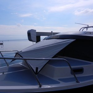 Media 'Or just the sides down low.' in album 'Awning was a basic square (I'll update side dimensions when I get back down to the boat).  Sides were cut with a curve to stretch tight when corners were pulled.  We used some leftover "Oyster" Sunbrella fabric.'