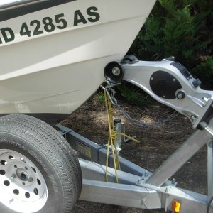 I ran without the yellow rope until I hit a highway bump at freeway speed and the bow rose up and off the winch roller.  You can see how the roller is distorted from riding that way for unknown number of miles until I spotted it.  I now have a strong tie to the frame.