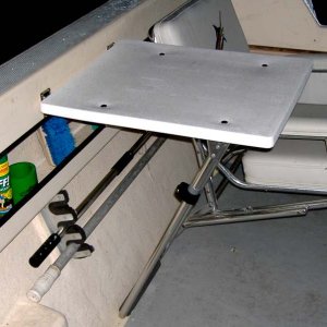 Cockpit table made from a jump seat frame.