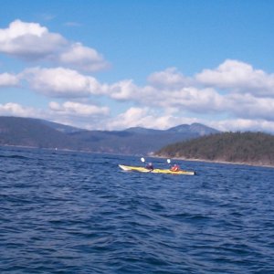 (seabran) Kayakers in double making a crossing - West of Mink Island.