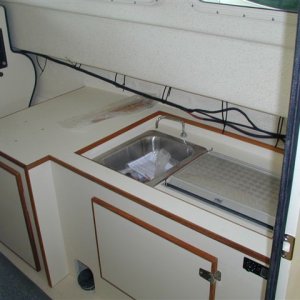 Hidden galley.  Same level as helm seat.
