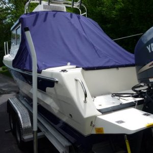 slant back canvas to keep cockpit clean and dry. Shares the zipper and snaps on rear of cabin with camper top obviously when camper top is not being used