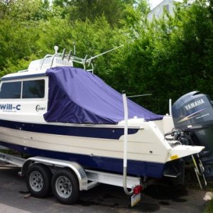 Just zip the top edge on do some snaps and wala,clean boat