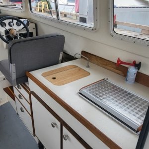 Nice clean galley and helm station.