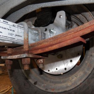 Very tight fit.  I had to bend some little stainless clips because they were interfering with the wheels.  I learned after reassembling that rusty leaf springs make for a rough ride because of "stiction."  Pulling them off (using an air wrench), sandblasting, and painting isn't too complicated and I may do that.