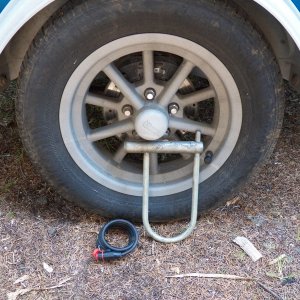 The new 15" tires had to be really skinny to fit the original fenders.  These aluminum "gasser" wheels fit the bill and are rough cast so the look fine after saltwater dunks.  I lock them to the springs if the trailer is left in an unsecured area.