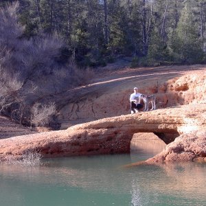 Son Mark and 6 month old Misty on natural bridge at Shasta Lake.