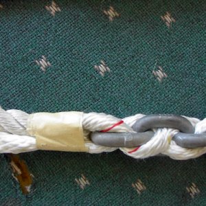 Chain/Rope Splice:  Third strand is wrapped around the last link in the chain then woven back into the rope using the standard one under, two over system with the strand also going in reverse twist to the rope, as seen in following photos.