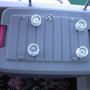 White plastic 2" to 1/2" PVC pipe bushings (reducers) make perfectly formed cups for Honda generator feet. Weight rests on fender washers, boltheads fit up into the generator's feet screw holes, and outer edge of bushing cups feet so they don't slip around.
