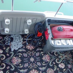 Box contains generator, bungee cords, 30 foot electric pig tail to Shore Power inlet, funnel, chain and padlocks, and three 1-gallon metal cans of gas. Fit will be a little tighter for Honda EU2000i generator.