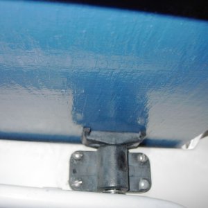 Supports under rack are made from cutoff rod holders by Fish-On that have been through-bolted down through the centers for tightness and strength.