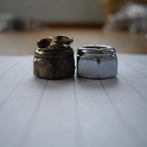 Melted nut on left and new nut on right.JPG