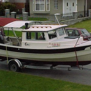 (BOMBERO) SOFT TOP ADDED TO  ROOF EXTENSION.....SOFT TOP STORES UNDER ALUMINIUM ROOF AND IS OUT OF THE WAY FOR BOARDING OR FISHING