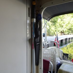 Boat Hook by entrance--second boat hook is stored in head/shower.  The machete by the door.  Freezer under the rag rug in the cockpit can be used as a seat.  Dedicated 12 and 110 V plugs for the freezer.