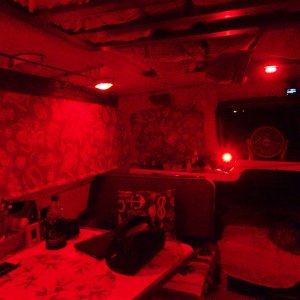 Red lighting fading forward.  There is the cabin red light up high.  chart red light below (can be white also), and the port forward overhead light is in red bright mode--it is also white in bright and dim motes.
