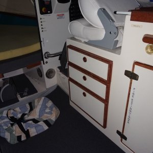 3 drawers under the helm seat. custom helm seat.  Ventilation for Inverter charger on aft and inner parts of Starboard V berth.  On the floor is bag which the AC unit sits in when not in the window.  This goes under the V Berth.  There is also vinyl loo mat on the floor of AC storage, and the cabin floor.  Dry deck under the mat.
