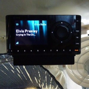 Sirius radio in center above opening window