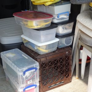 boxes which are kept under the cockpit and under the slash well.  These contain electrical adaptors, pump for the inflatable boat, spare engine parts, and shade cloths for the cockpit (keeps the sun out, yet allow ventilation.