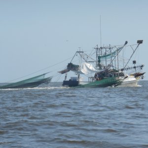 Shrimper pulling up his nets.