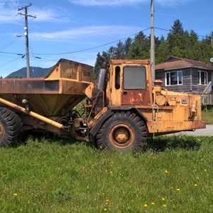 An articulated dump truck of unknown vintage and still operational.