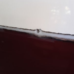 after filling the crack and all the holes with thickened epoxy I put the rail back up and redrilled only the holes that I was putting a bolt thru