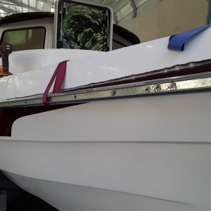 Media 'I started drilling holes at the back of the boat and worked my way to the front.  the back has the sharp bend, so I wanted to make sure that it fit good around the bend' in album 'a heat gun helps get it started'