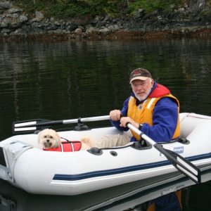 Our Tender "Guppy" with Ross and CoCo. A 2004 7'-3" x 3'-9" Ax Bombard inflatable. 1'-1" tube diameter, 33 lbs. and powered by a 2 hp. Honda 4 stroke.