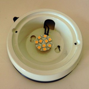LED "puck" glued to old housing, wires routed to existing switch