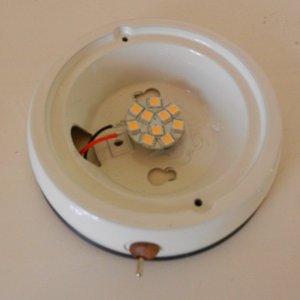 Media 'LED "puck" glued to old housing, wires and new switch installed' in album 'Modified USB chart light'