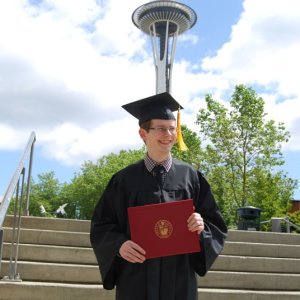 Media 'Showing off the diploma.' in album 'Getting that paper handed to him.'