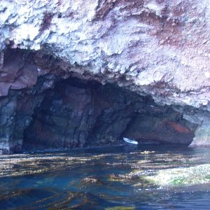 Looking into the cave that goes through. Note the rock & seaweed.