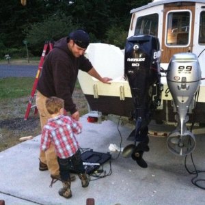 my son helping me on fathers day work on boat