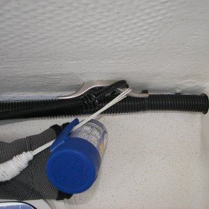 Media 'That's a plastic bag dispenser and a mesh gear hammock hanging off that cleat. Remember you must use SHORT SCREWS in this area to avoid damaging the exterior gelcoat!' in album 'Shock cords on small cleats over windows allow you to hang things, tie up the forward fenders and clip the window covers in varying positions to fit the conditions.'