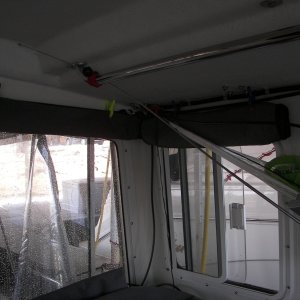 Media '100 0545' in album 'Shock cords on small cleats over windows allow you to hang things, tie up the forward fenders and clip the window covers in varying positions to fit the conditions.'