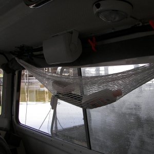Media 'You can also clip up wet maps to let them dry, or "pin-up" pics...  of your favorite C-Dory, of course.' in album 'Shock cords on small cleats over windows allow you to hang things, tie up the forward fenders and clip the window covers in varying positions to fit the conditions.'