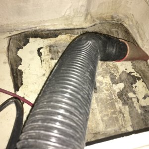 shop vac then through tubes inserted in grid of holes