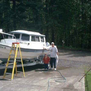 Grandson Aric helping Papa clean up the Mary Ellen.