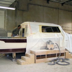 (Pat Anderson) 4-1-05 They drape the cabin and mask and tape all the openings.