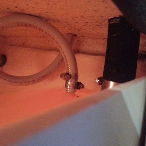 Avoiding the sharp bend that pinched and cracked the original vent hoses